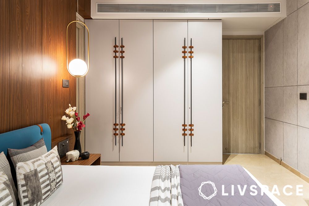 white wardrobe in a bedroom with wooden panels 1