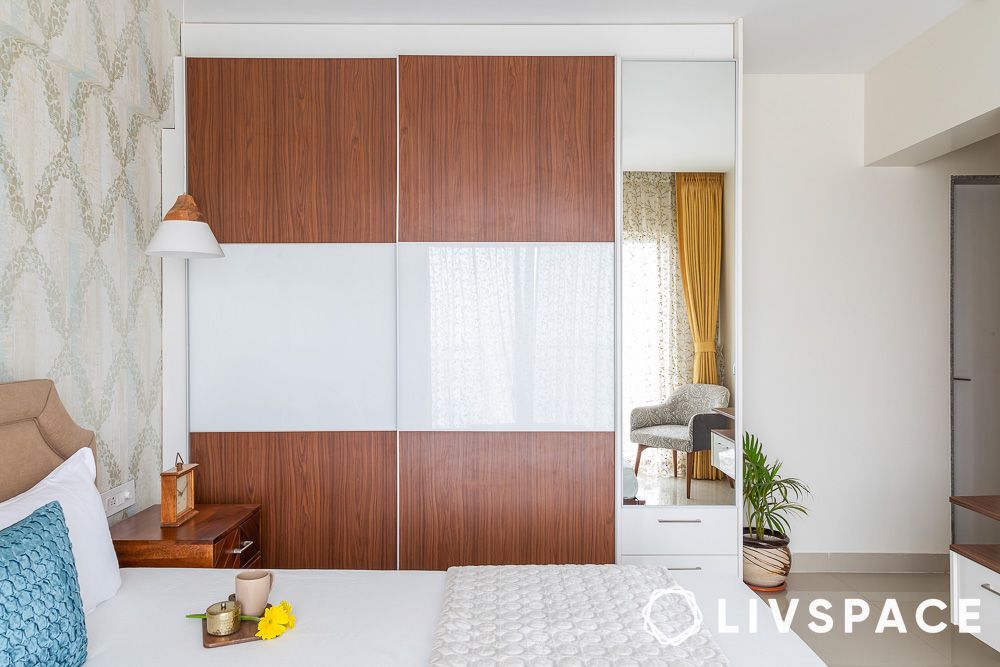 wooden and white wardrobe in a bedroom