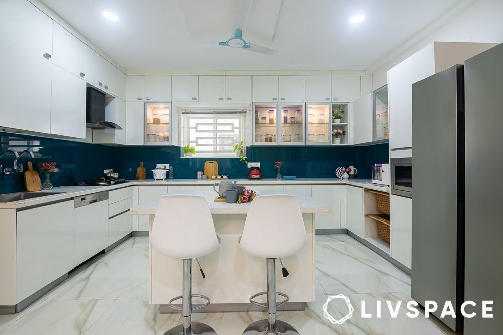 white kitchen design with blue glass dado breakfast bar