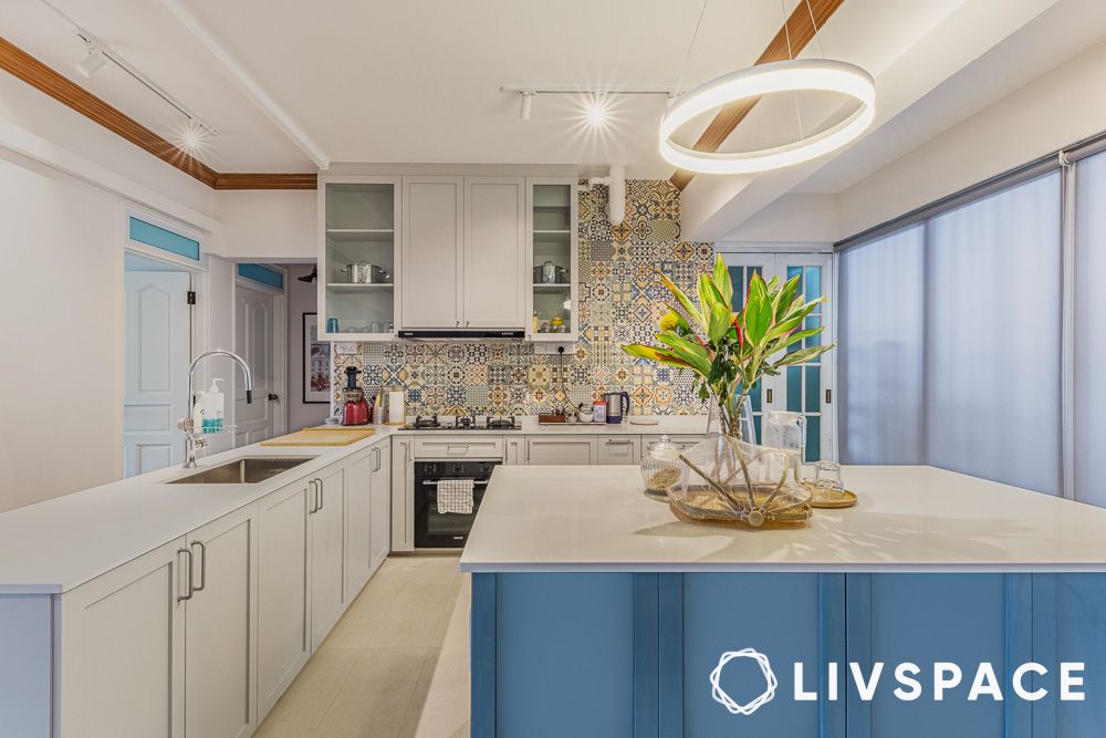 white kitchen with cabinets and unique lighting