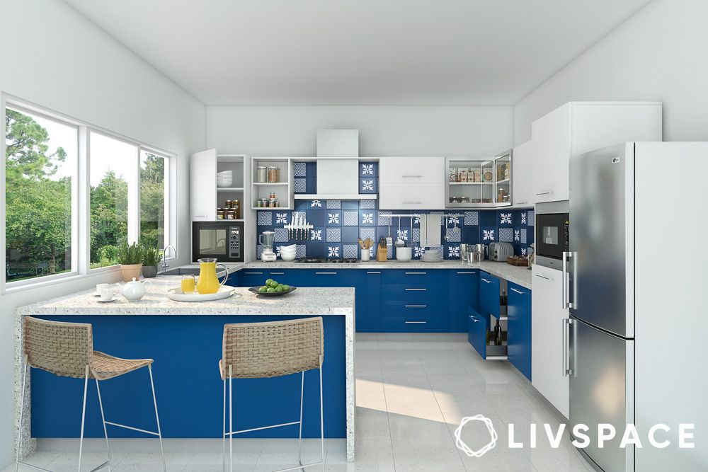 white kitchen design with blue cabinets and peninsula