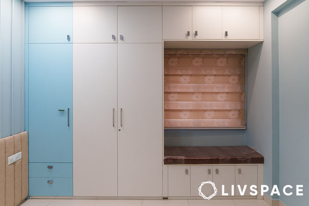 blue and white wardrobe with daybed