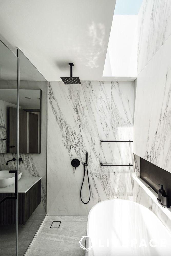 skylight above a bathtub in a bedroom