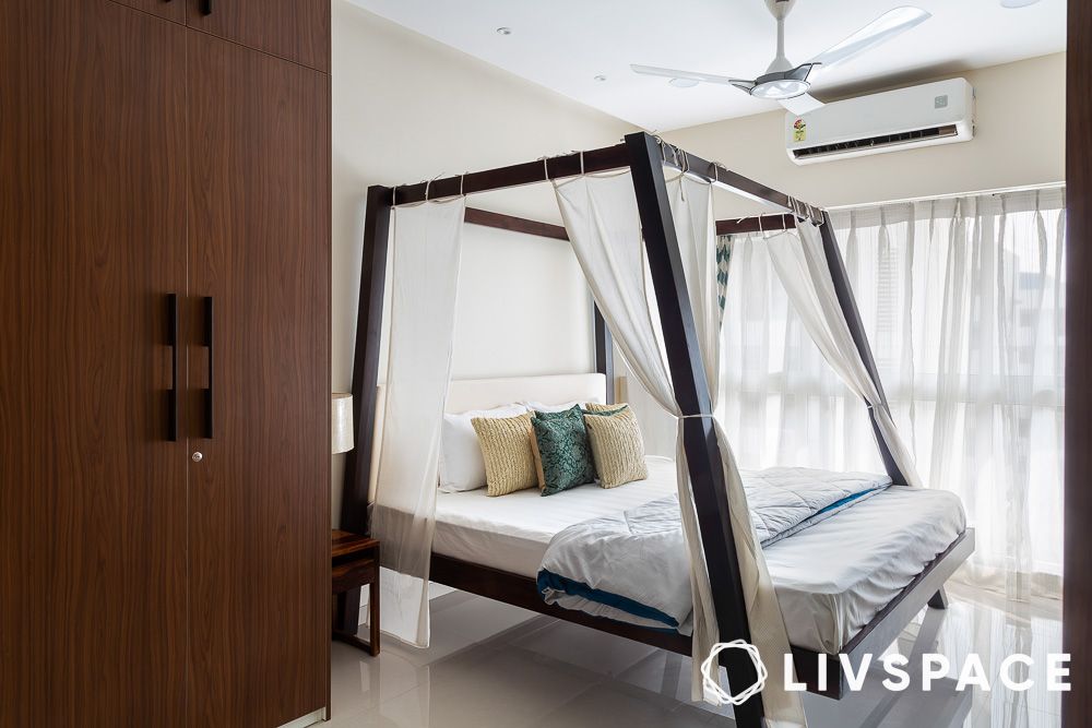 canopy style bed in an airy bedroom