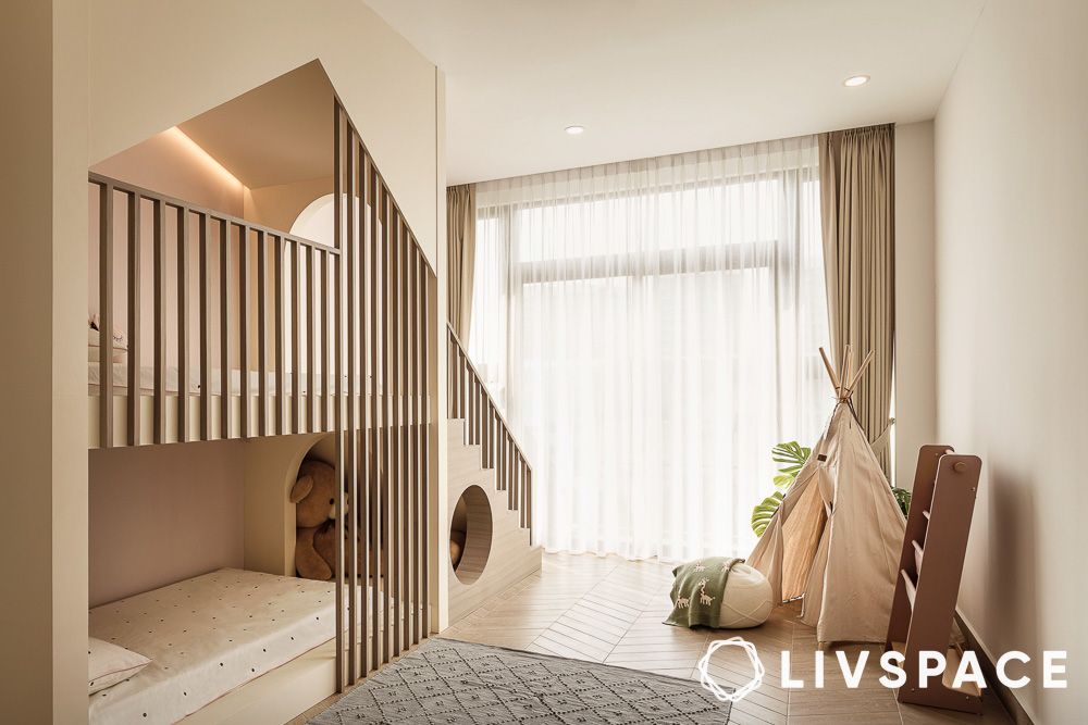 kids room with beige bunk beds and tent decor