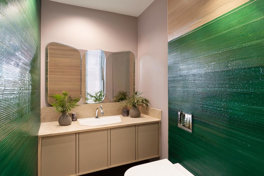 Beige colour combination with peacock green in a bathroom