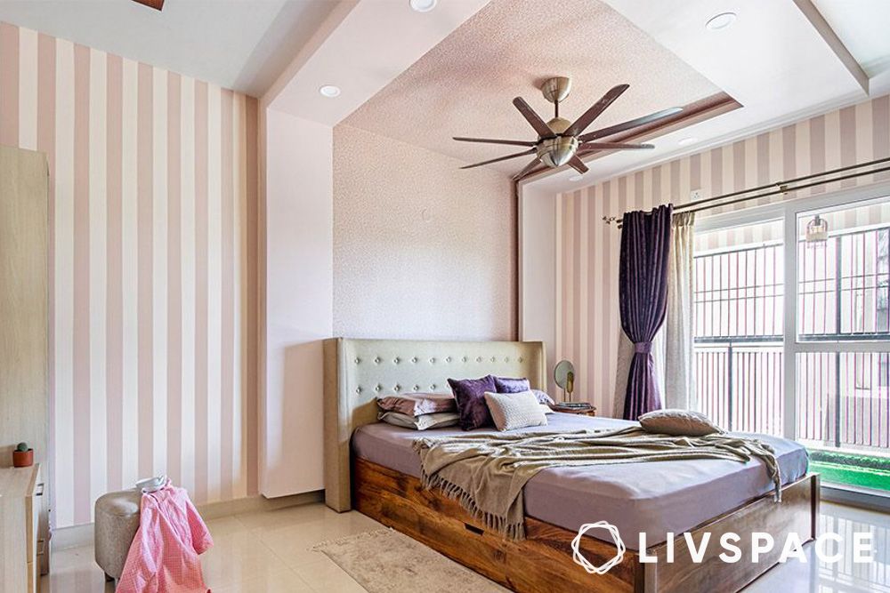 Wall to ceiling POP ceiling design for bedroom with pink striped wallpaper