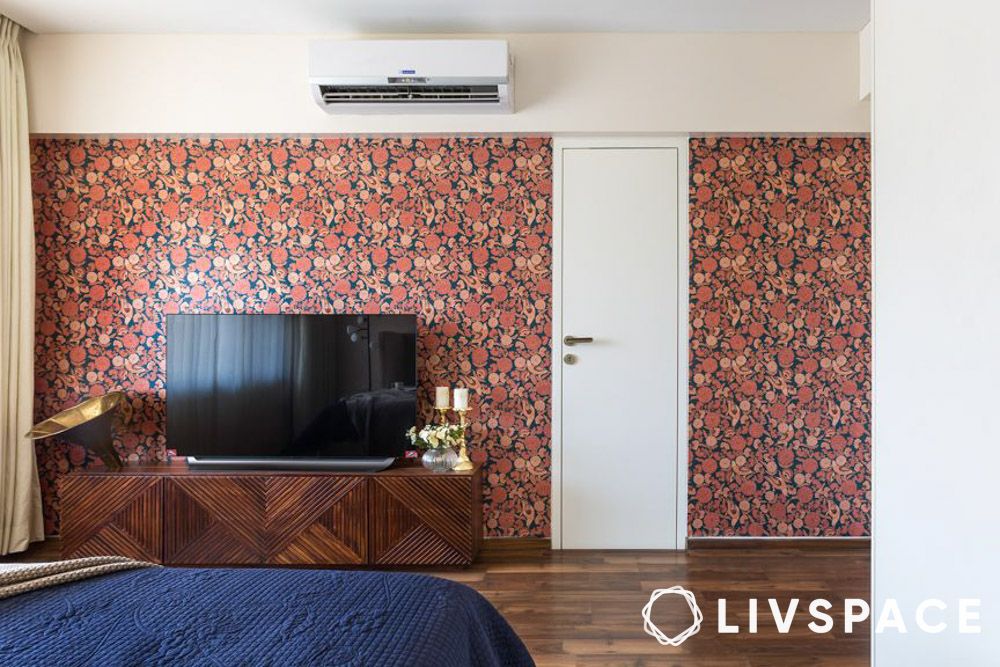 tv unit against floral wallpaper