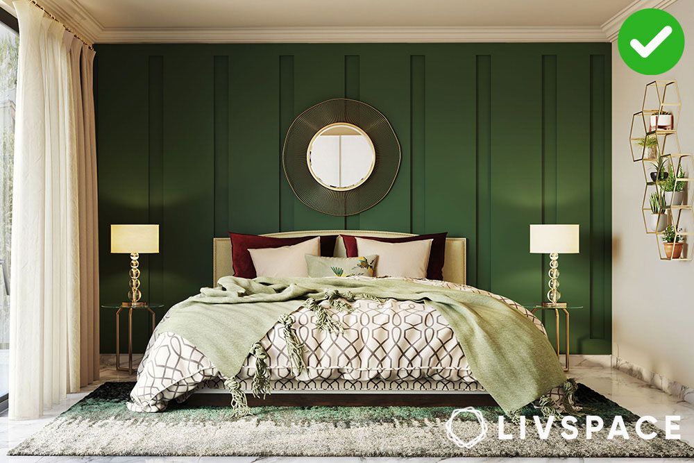 Green wall painted panel on a feature in a modern bedroom design