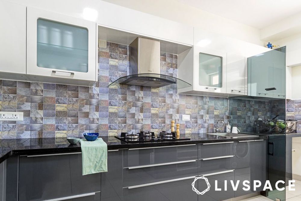 Grey and white kitchen with a separate utility area