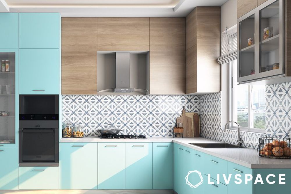 Blue L shaped kitchen design with tall units