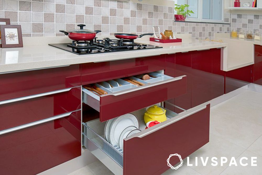 Red L shaped kitchen design loaded with accessories
