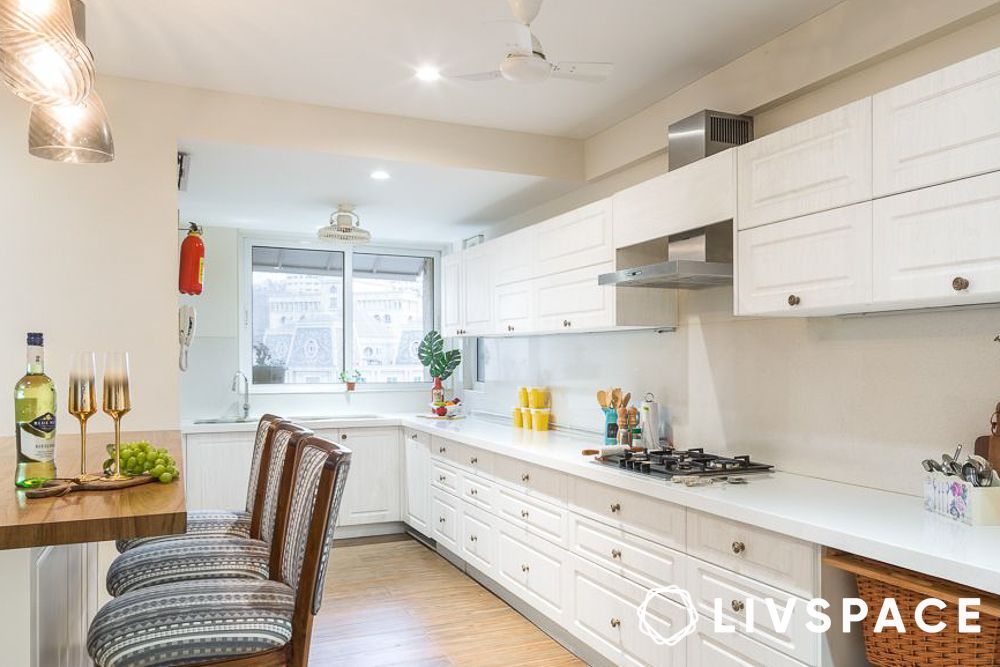Country style white kitchen with wooden flooring