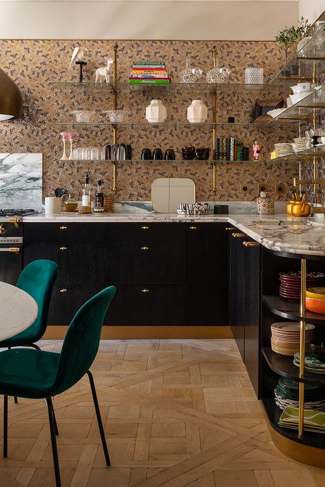 L shaped kitchen with hanging racks and no upper cabinets