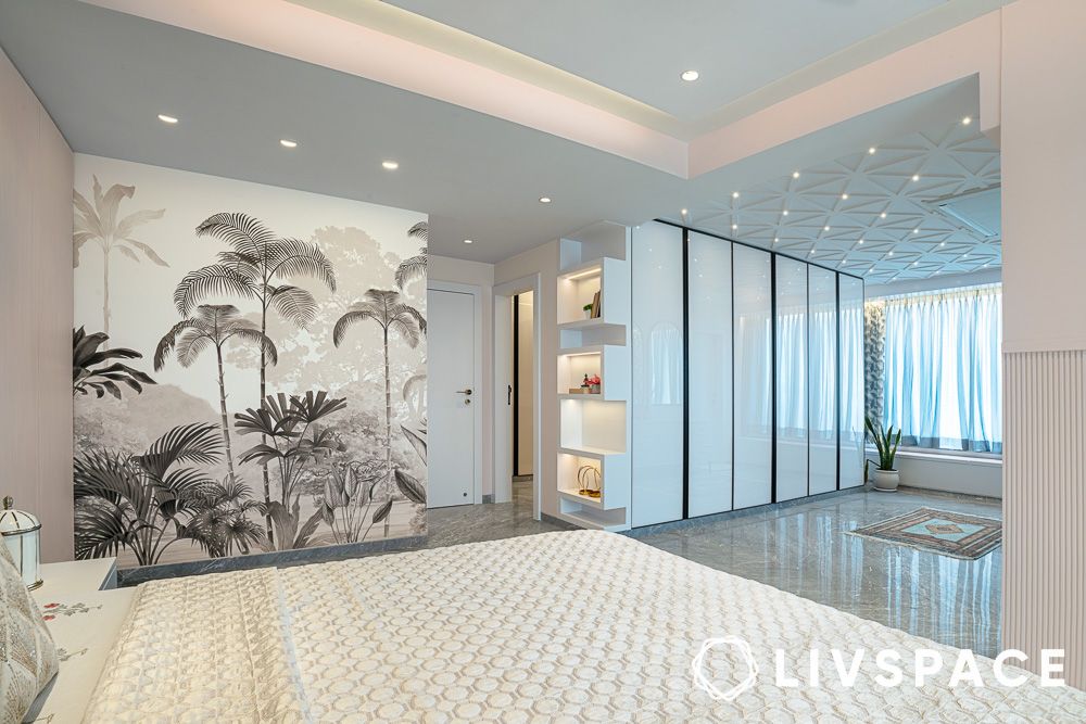 Glossy wardrobe in the dressing area with jungle wallpaper design