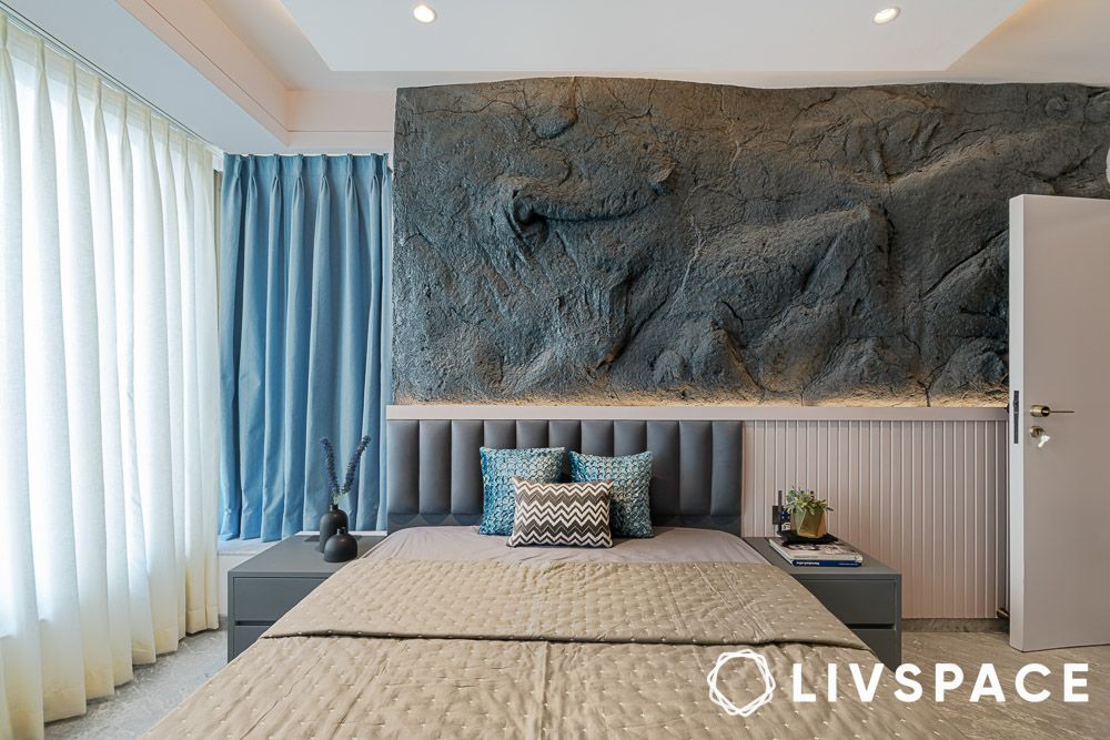 Stone wall cladded bedroom design