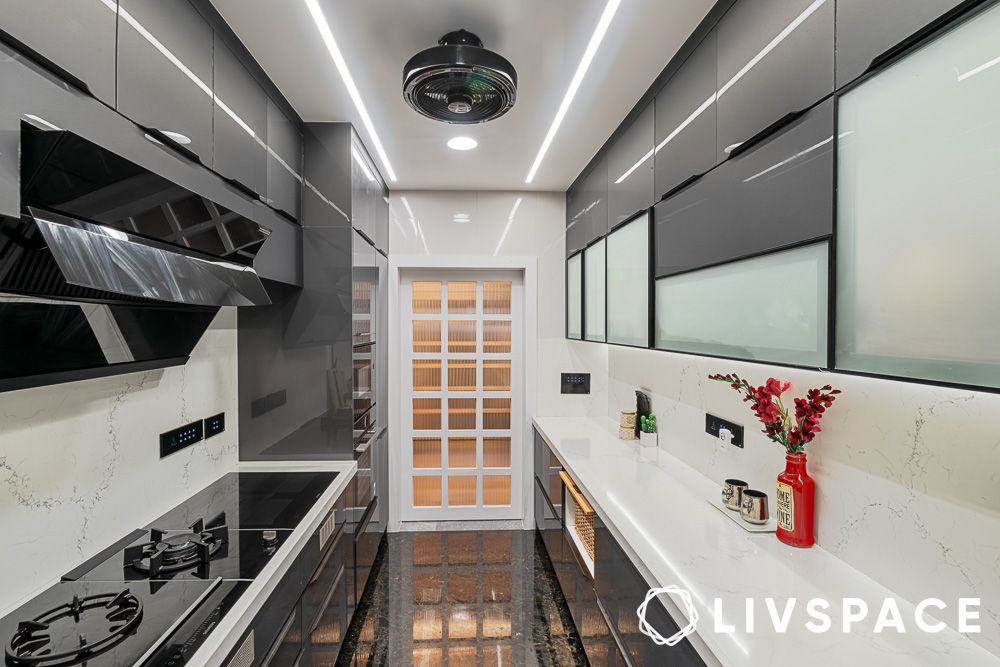 Parallel kitchen design with grey glossy laminates
