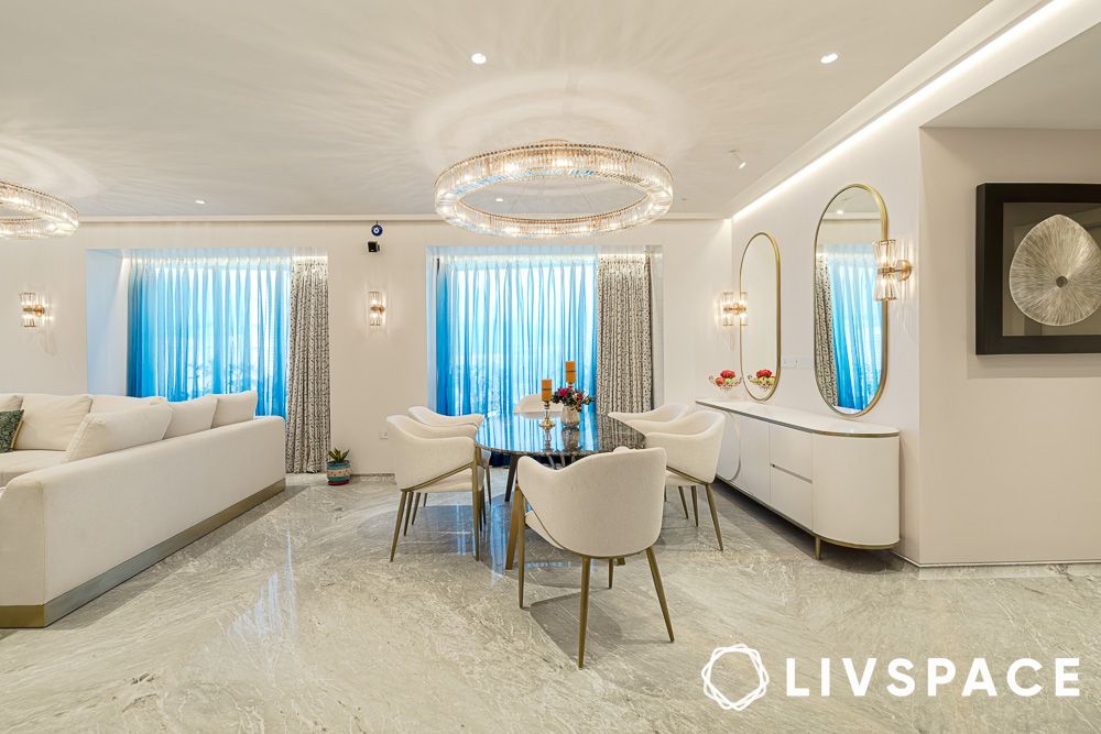 white open living room cum dining room with modern chandelier design