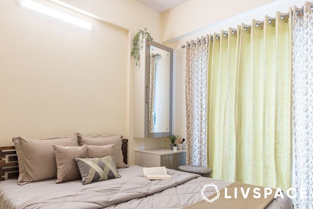 2bhk interior cost in bangalore with neutral bedroom and dresser unit