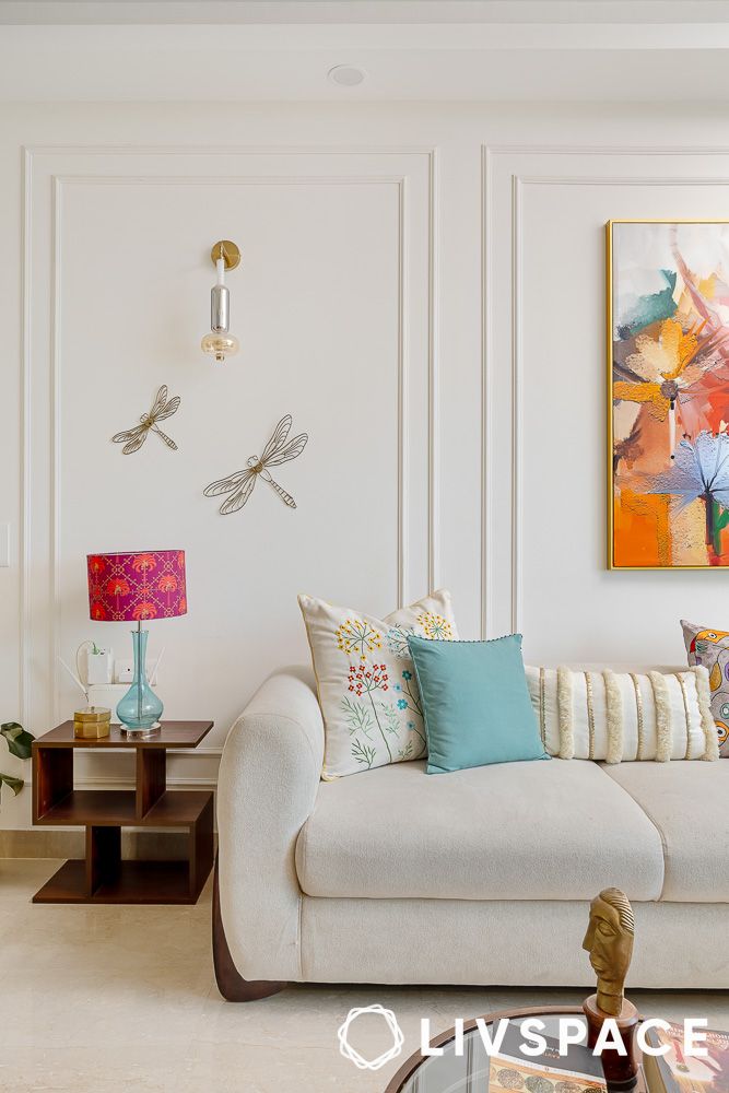 living room with wainscotting details and sofa