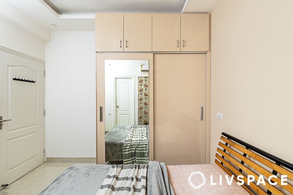 sliding mirror wardrobe in guest bedroom