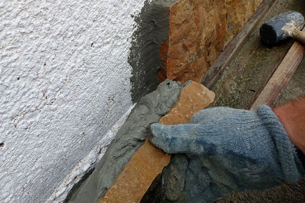 Applying stone cladding to the walls