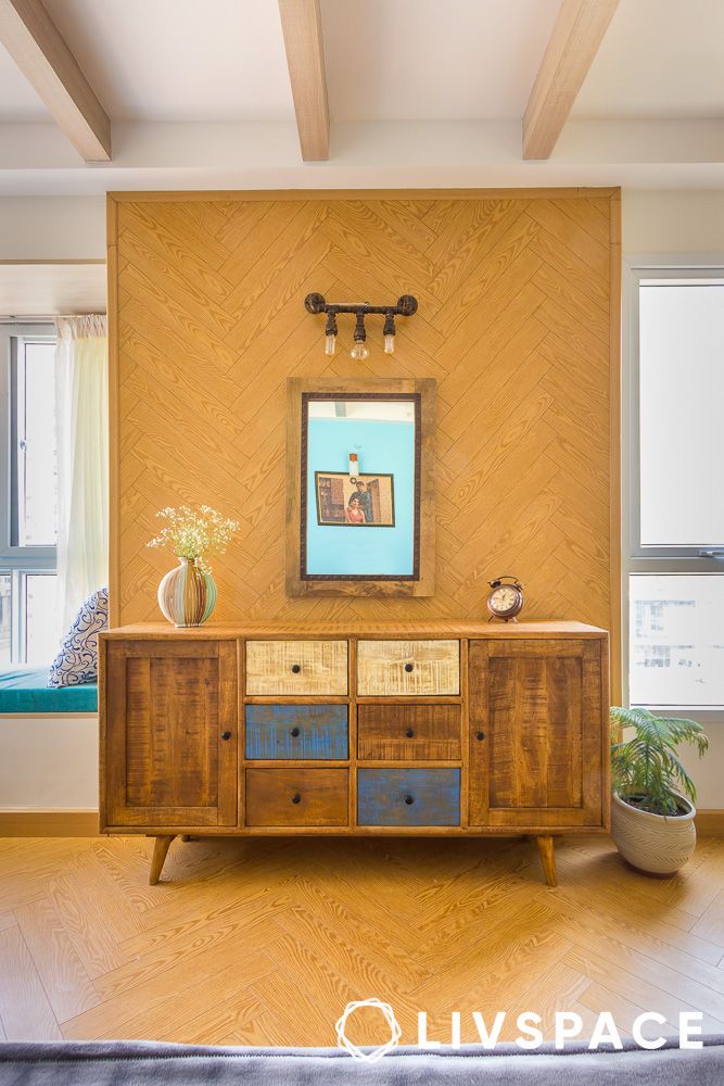 a console table in bedroom made of reclaimed wood
