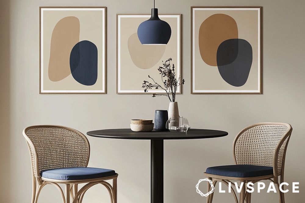 Small dining room wall decor idea with framed abstract art