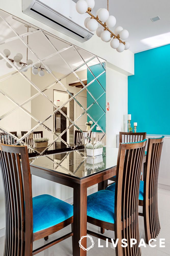 Mirrors can reflct light to make a small dining room appear larger