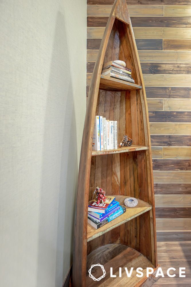 a canoe shaped wooden shelf