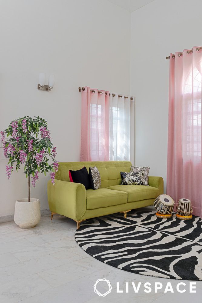 animal print rugs in a living room with pink curtains