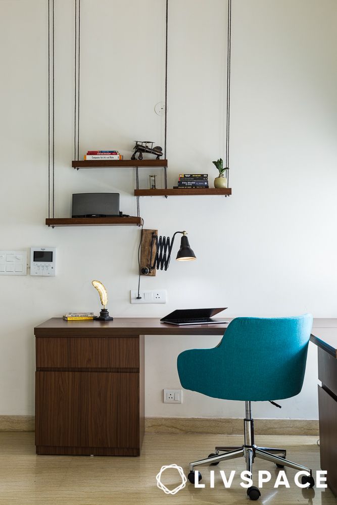 floating shelves that look like they are suspended with ropes in a study room