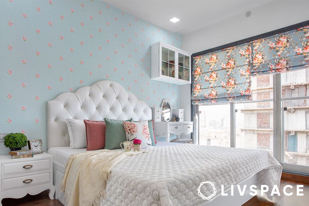 floral blinds in a blue coloured bedroom