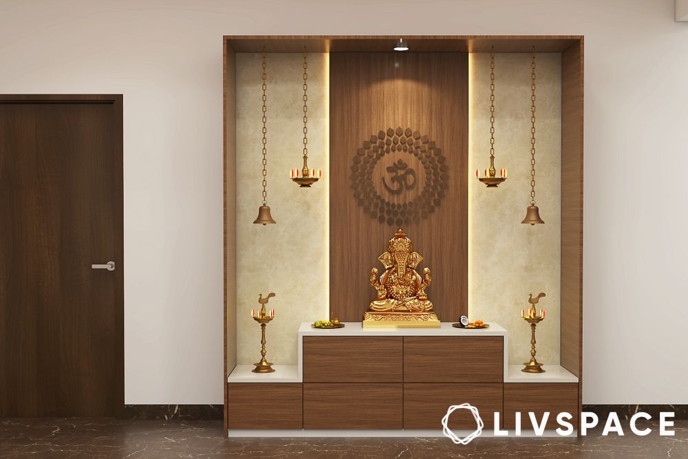 ganpati murti with bells and lamps