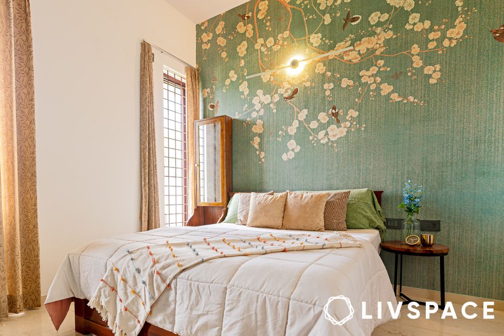 a green bedroom with white bedding set