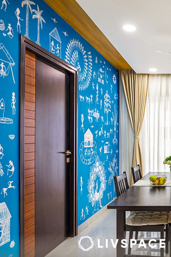 warli art in a living room accent wall