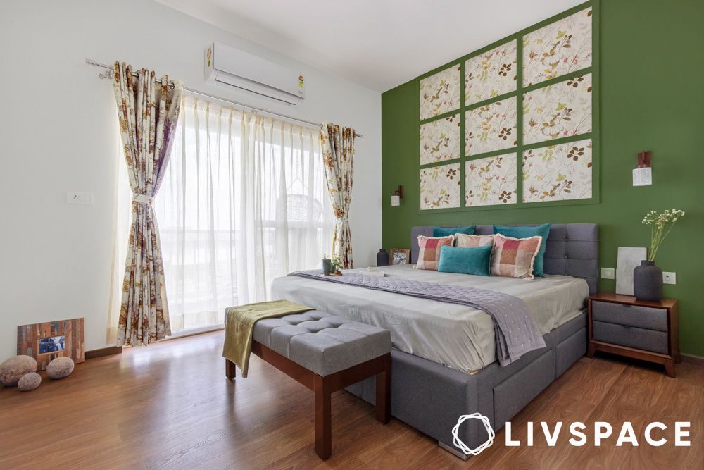 floral wallpaper and green wall in bedroom