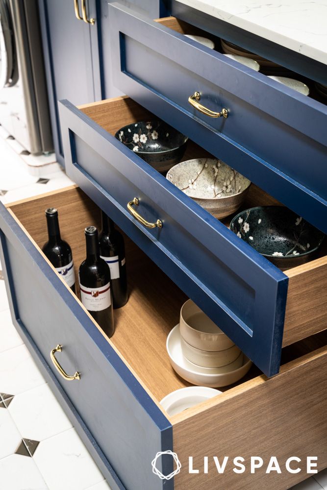 blue kitchen drawer with gold handles