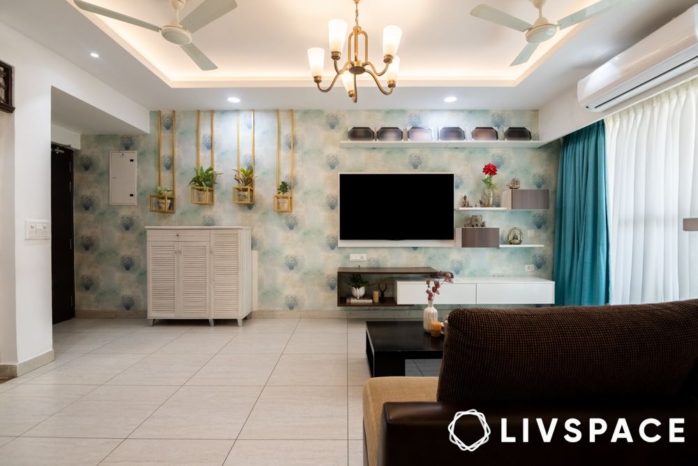 living room with hanging planters chandelier