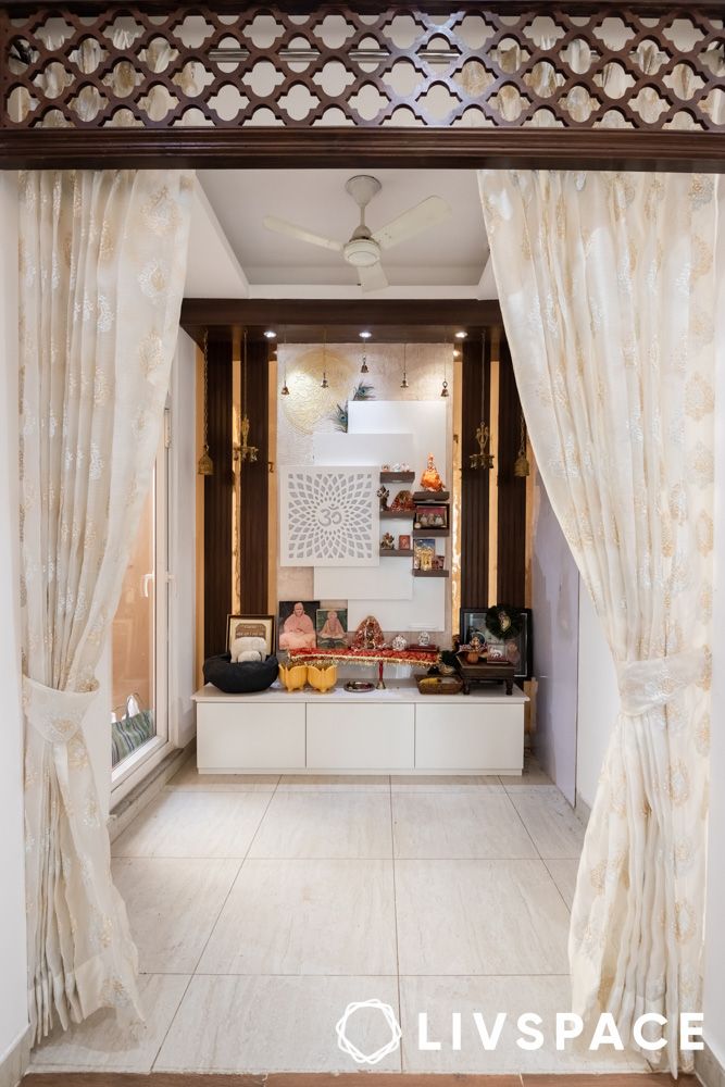 pooja room interior design with seating space jaali frame curtains