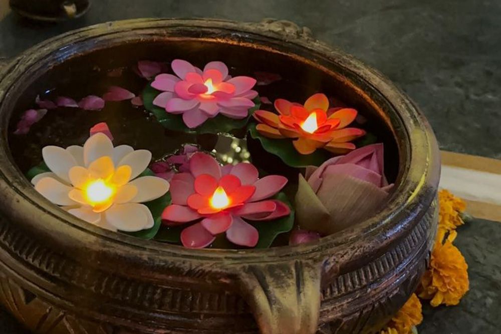 floating floral diya in a urli