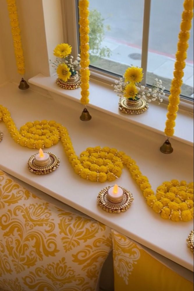 diwali decoration ideas tealights and marigold on window sill