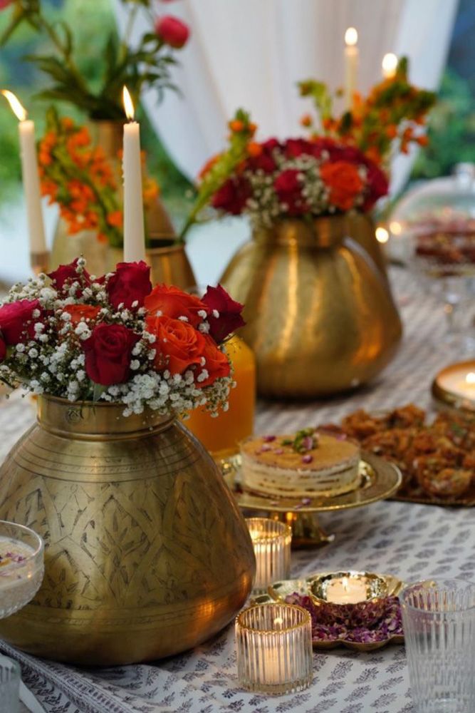 diwali decoration ideas brassware and flowers on a table