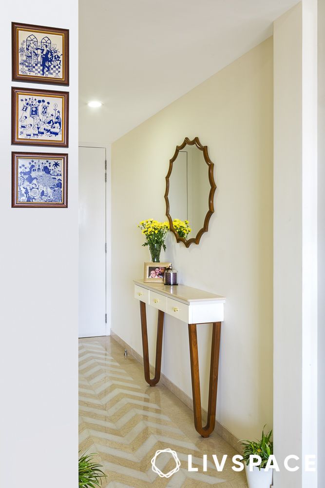 Console tables styled with mirror and decor