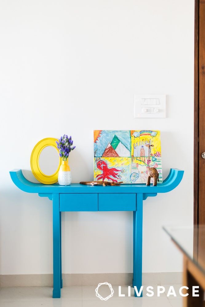 Narrow console table against hallway wall