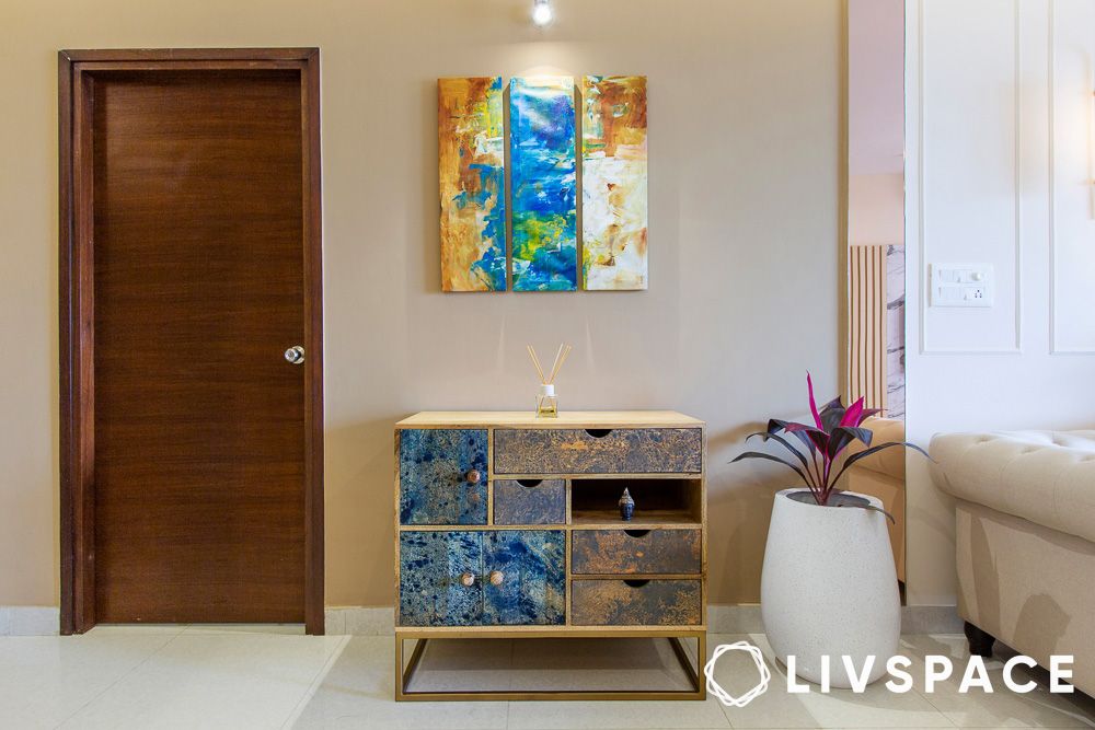 Hallway table styled with lamp and artwork