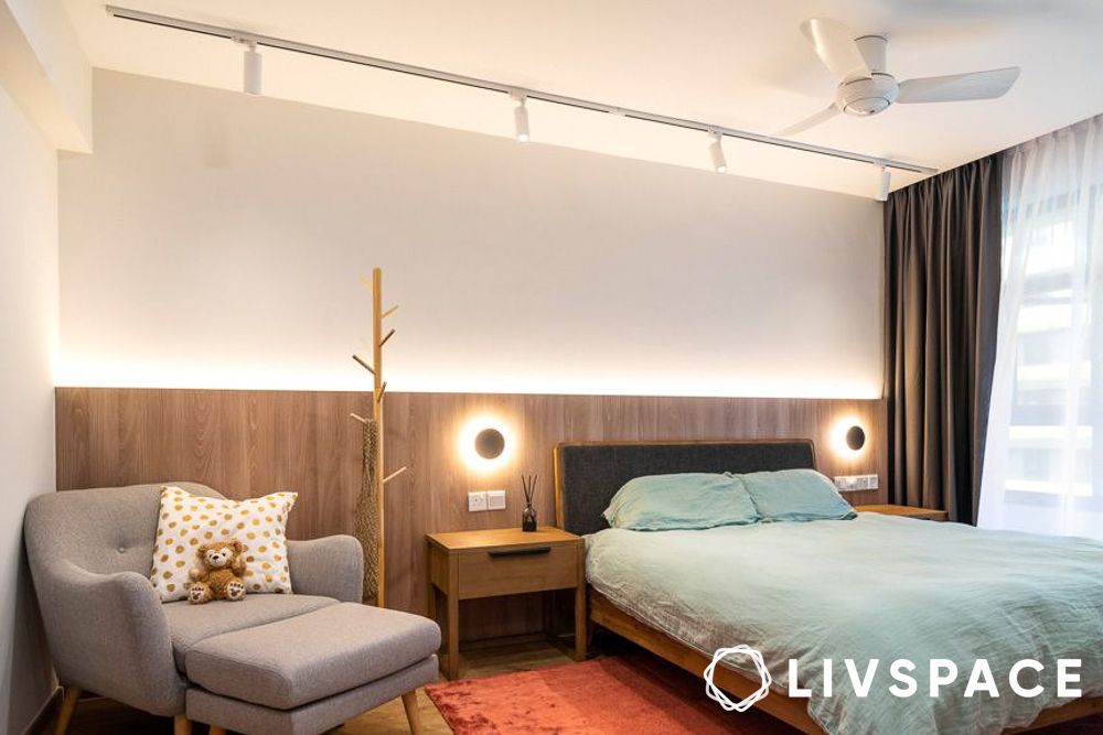 modern bedroom with wooden wainscoting and wall sconces