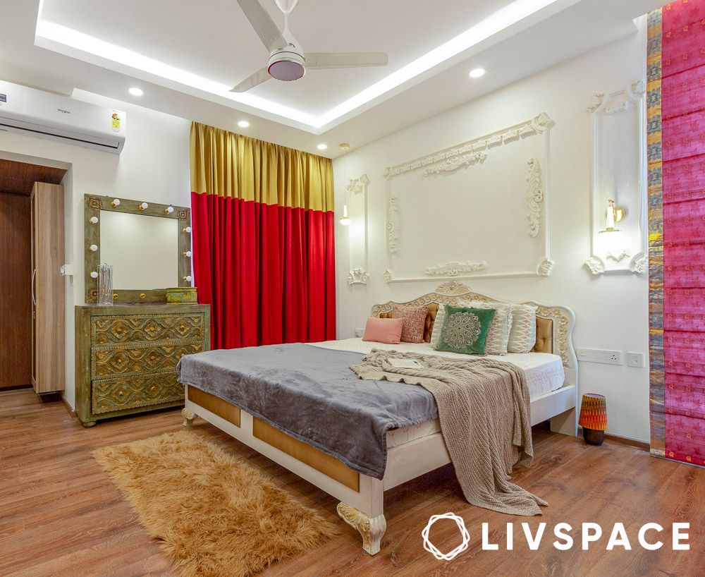 Thin POP border ceiling with cove lighting in a Kolkata bedroom