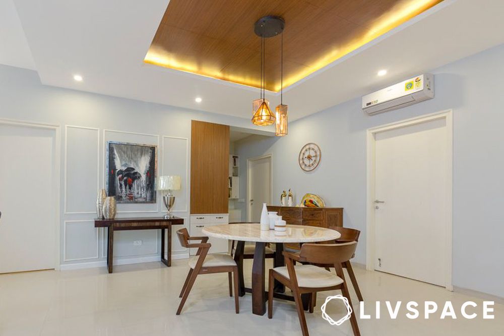 Wooden rafter false ceiling with fan in a Chandigarh bedroom