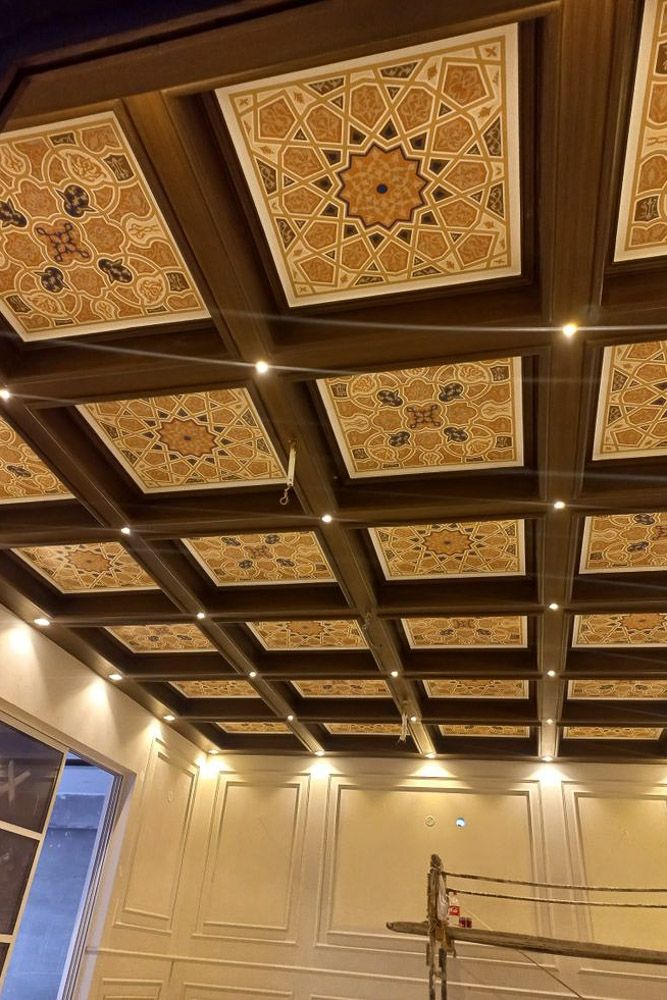 Wooden rafters over POP base with fan between beam